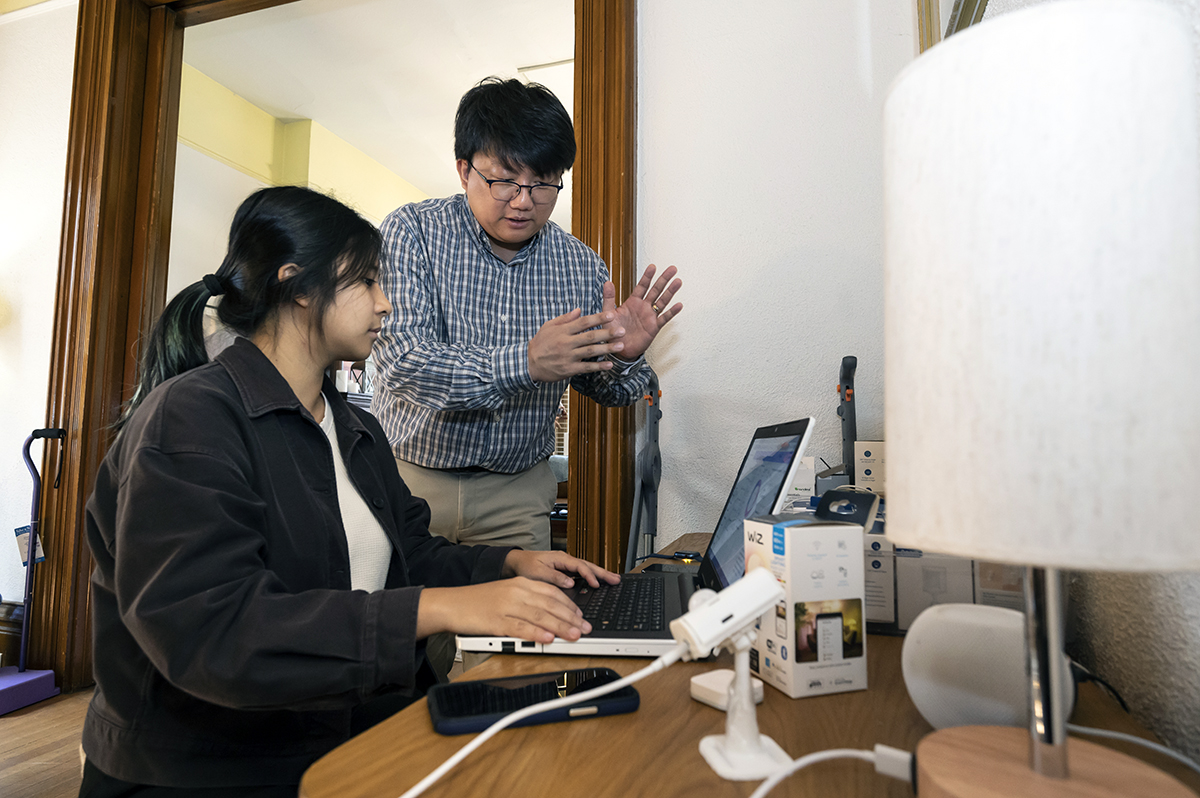 Sukritta Suksawang, a graduate student in the Department of Bioengineering of the Swanson School of Engineering, works on a project utilizing smart technology to bolster the independence and safety of older adults with a mentor, Yong Choi, an assistant professor in the Department of Health Information Management in the School of Health and Rehabilitation Sciences.